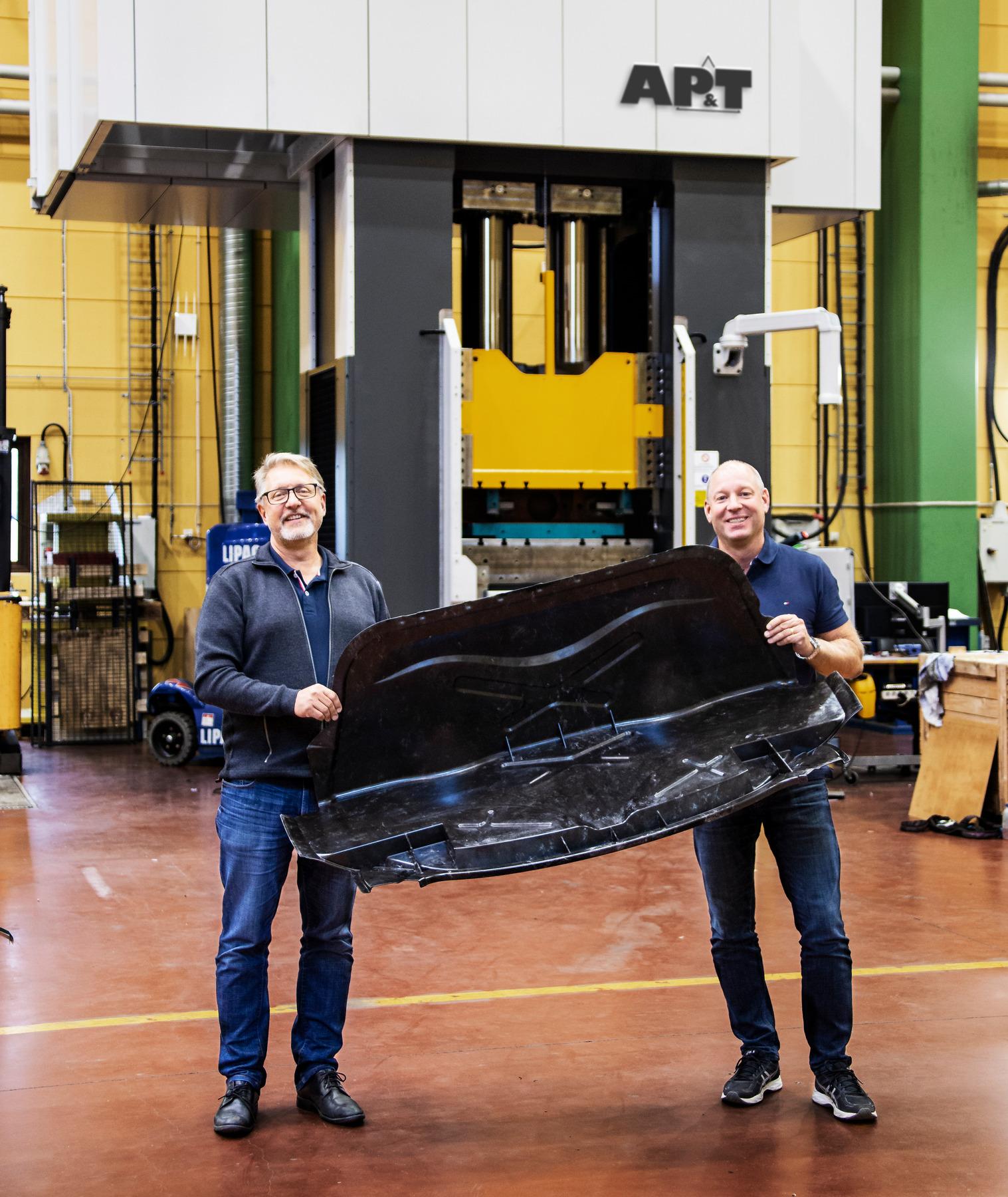 The use of lighter composite materials may be on the rise for the cars of the future. Kent Eriksson and Roger Nyman of AP&T display a combined hat rack and back wall made of an advanced carbon fiber composite. 