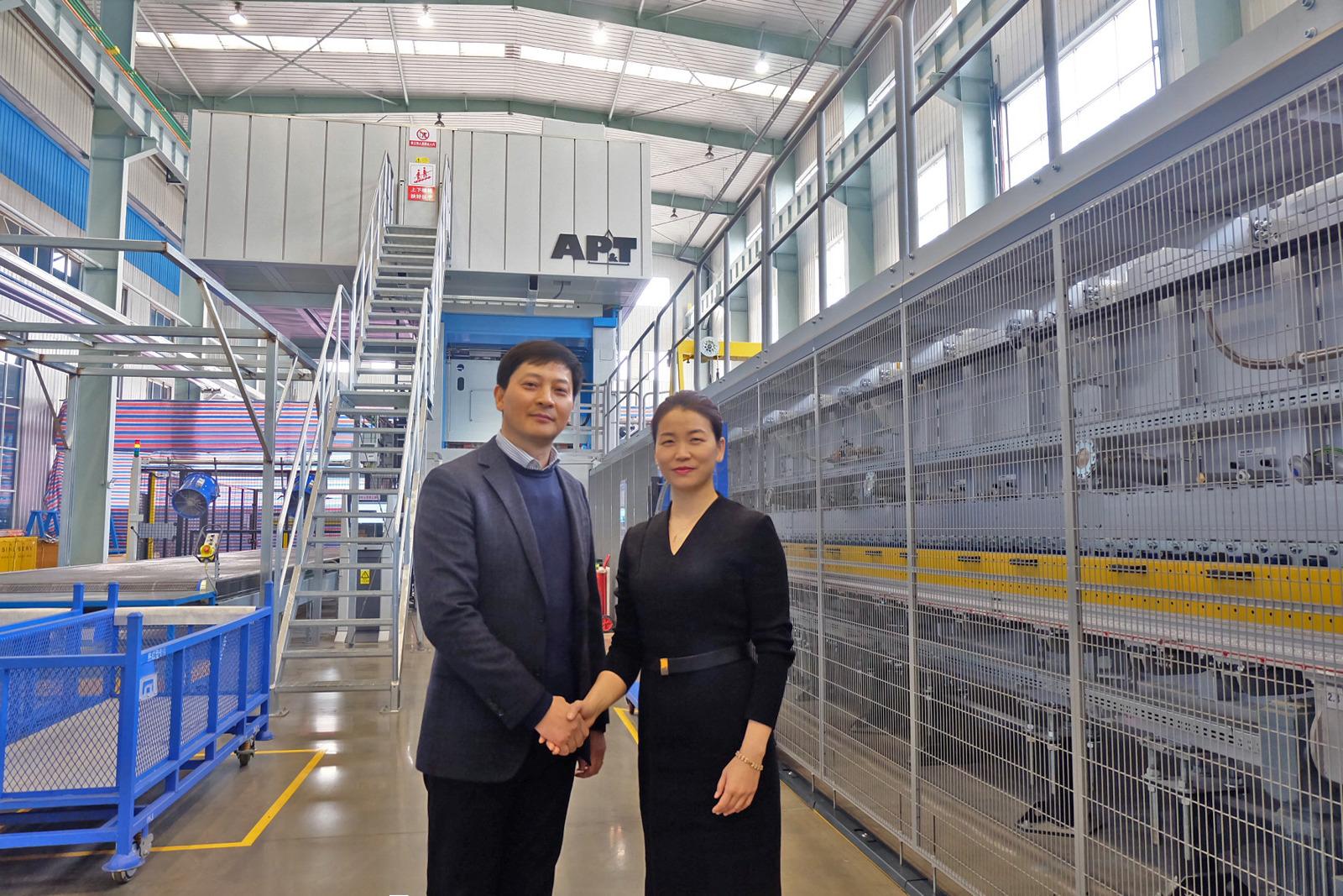Successful cooperation. Mr. Huang Yinquan, Vice General Manager at Xincheng Automotive Industrial, together with Ms. Kimi He, General Manager at AP&T China. 